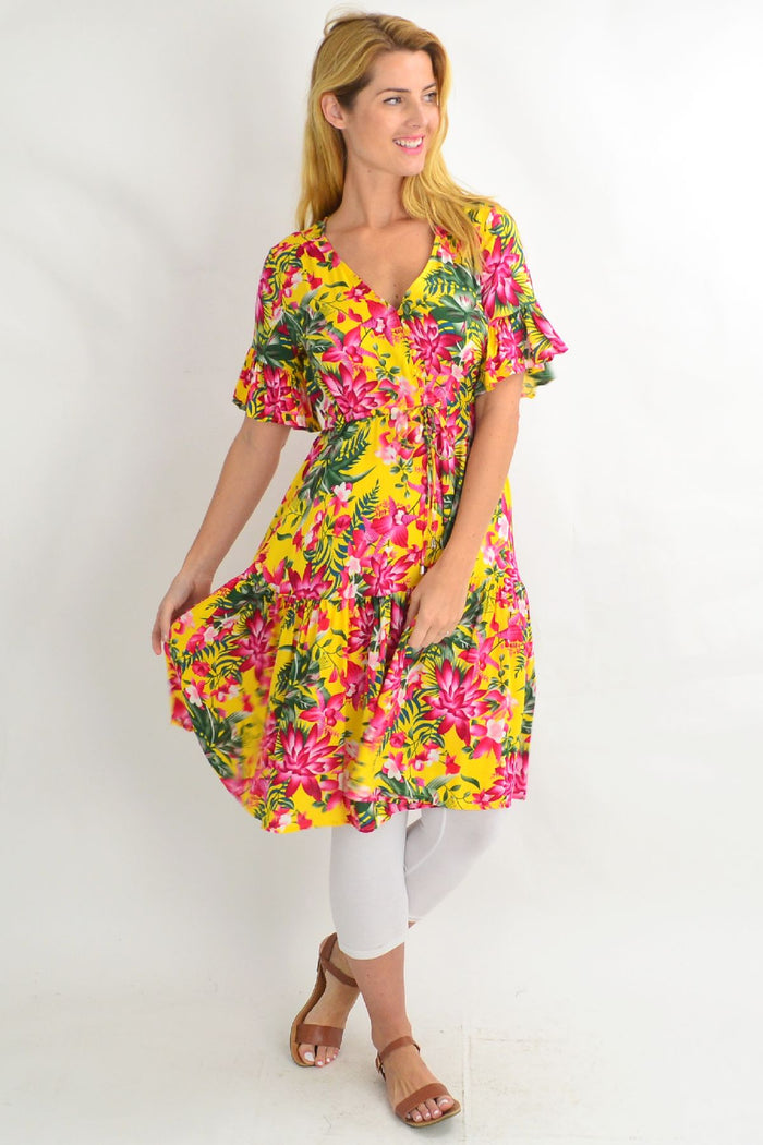 Yellow frilly orchid tunic dress by Willow Tree featuring pink floral patterns and a flowy, lightweight fabric.