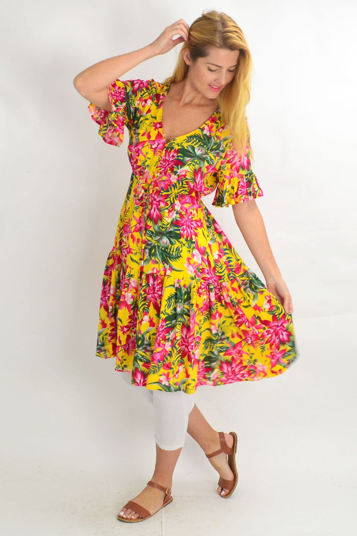 Yellow frilly orchid tunic dress by Willow Tree with pink floral pattern, lightweight and flowy fabric, perfect for casual wear.