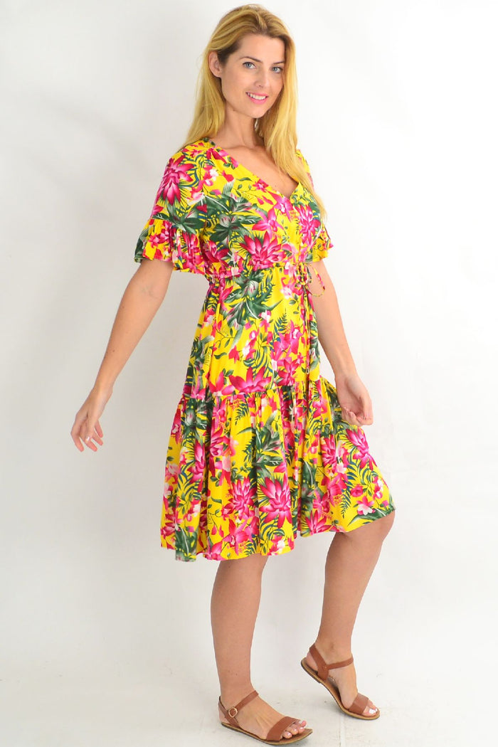 Yellow frilly orchid tunic dress by Willow Tree featuring pink floral patterns and a flowy, lightweight design.