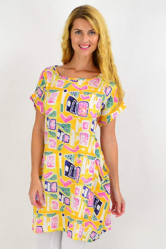 Yellow teen tunic dress by Peony featuring a flowy design and long sleeves, displayed on a hanger.